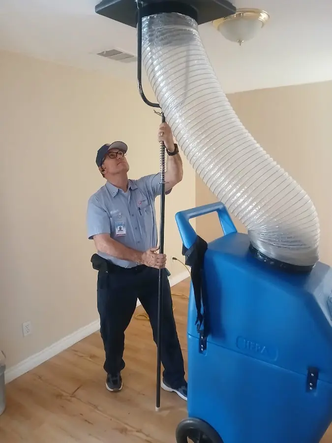 Furnace Tune-Up technician using HEPA equipment in Gahanna
